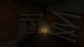 The second floor in the loft with a lone candle